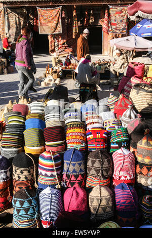 Colourful hats and tourist souvenirs crafts for sale at this square, the Criee Berbere (carpet souk) one of the few open spaces Stock Photo