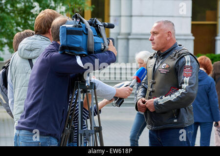 Prayer for the Day of memory and grief, beginning of the WW II. First in Kaliningrad procession on motorcycles and priest Stock Photo