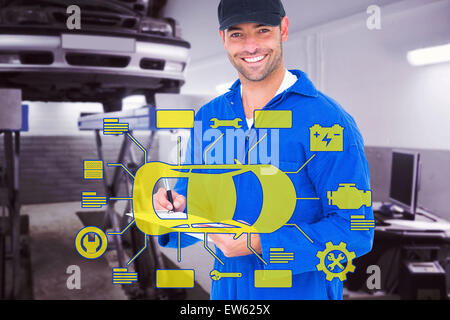 Composite image of handyman in blue overall writing on clipboard Stock Photo