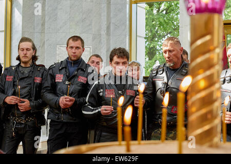 Prayer for the Day of memory and grief, beginning of the WW II. First in Kaliningrad procession on motorcycles and priest Stock Photo