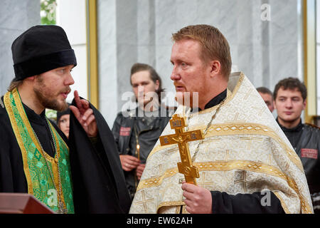 Prayer for the Day of memory and grief, beginning of the WW II. First in Kaliningrad procession on motorcycles and priest Stock Photo