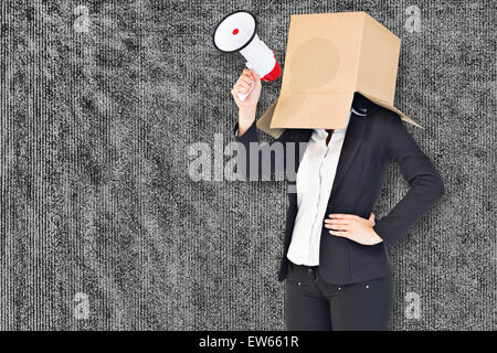 Composite image of anonymous businesswoman holding a megaphone Stock Photo