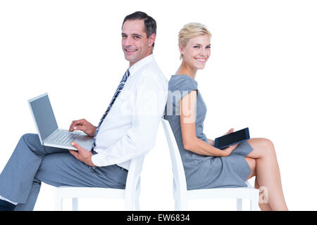 Businesswoman using laptop and tablet Stock Photo