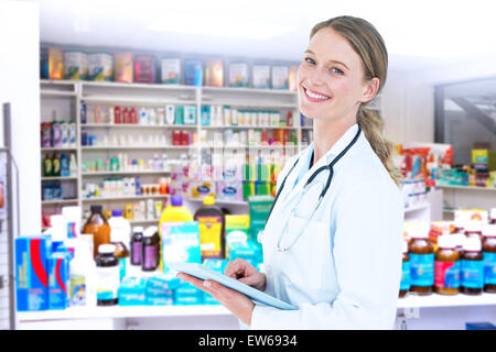 Composite image of doctor using tablet pc Stock Photo