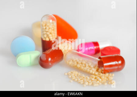 Many colorful pills isolated on white Stock Photo