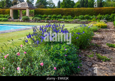 Flowering border around the swimming pool at Bowood House in Wiltshire. Stock Photo