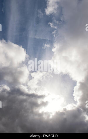 Sun burst behind rain clouds. Scotland Stock Photo
