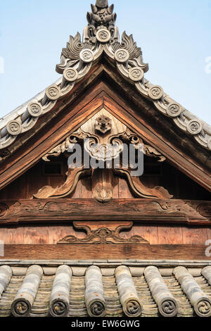 Roof detail of the main hall of the Achi-jinja Shrine in Kurashiki, Japan. View of the kegyo, end panal, with the Hafuita, the top roof beam. Stock Photo
