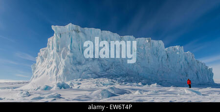 A man stands next to the Barne Glacier. Stock Photo