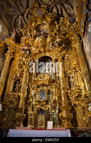 Altar of the Rosary with Madonna and child in Saint Mary of the Assumption basilica in Arcos de la Frontera Spain Stock Photo