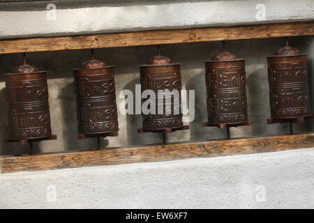 Tibetan prayer wheels used by Tibetans practicing Buddhism at Prague Zoo, Czech Republic. Stock Photo