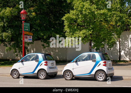 Car 2go Smart Cars fortwo parked on a street in Chinatown, Vancouver, BC, Canada Stock Photo
