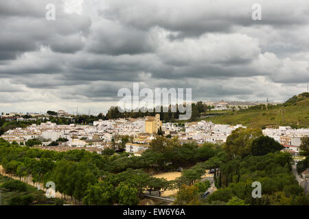 Whitewashed houses in village of Arcos de la Frontera Spain with dark clouds Stock Photo