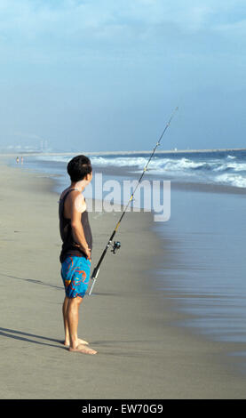 Man fishing on an empty beach in California         FOR EDITORIAL USE ONLY Stock Photo