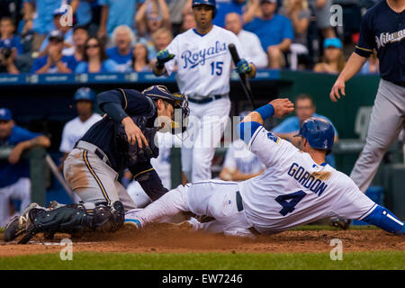 Kansas City, MO, USA. 18th June, 2015. Alex Gordon #4 of the Kansas City Royals is tagged out at home plate by Jonathan Lucroy #20 of the Milwaukee Brewers in the third inning during the MLB game between the Milwaukee Brewers and the Kansas City Royals at Kauffman Stadium in Kansas City, MO. Kyle Rivas/CSM/Alamy Live News Stock Photo