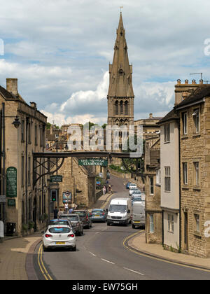 Stamford High Street St Martins with The George Hotel Arch and St Mary's Church, Stamford, Lincolnshire, England, UK. Stock Photo