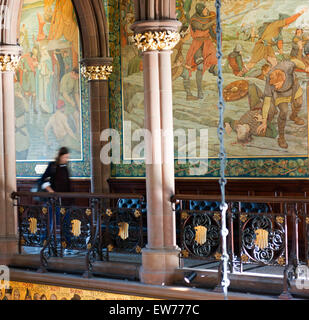A woman walks through the atrium in the Scottish National Portrait Gallery. Stock Photo