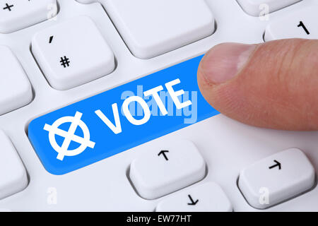 Online vote button election on the internet computer keyboard Stock Photo