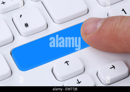 Finger pushing empty button on computer internet online with copyspace Stock Photo