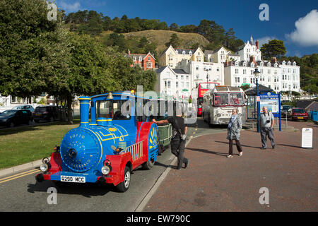 UK, Wales, Conwy, Llandudno, North Beach, passengers boarding land train to West Beach Stock Photo