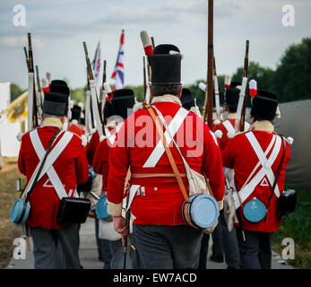 Lions Mound, Belgium . 18th June, 2015. Waterloo, Re-enactors from different countries gathered in Waterloo to participate in the commemoration for the 200th anniversary of the Battle of Waterloo. 18th June, 1815. Men dressed in military uniform of the 19th century march outside a camp in Waterloo, Belgium, June 18, 2015. Re-enactors from different countries gathered in Waterloo to participate in the commemoration for the 200th anniversary of the Battle of Waterloo, bringing to life the legendary battle happening on June 18, 1815. Credit:  Zhou lei/Xinhua/Alamy Live News Stock Photo