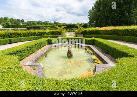 Pond and stone cherub fountain in formal gardens, Domaine de Villarceaux, near Chaussy, Ile-de-France, northern France Stock Photo