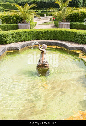 Pond and stone cherub fountain in formal gardens, Domaine de Villarceaux, near Chaussy, Ile-de-France, northern France Stock Photo