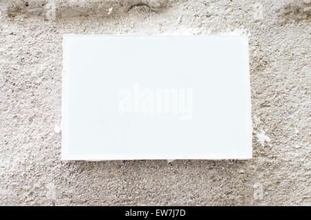 White and blank picture frame on a cement wall Stock Photo