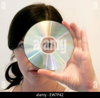 Woman holding a CD Stock Photo