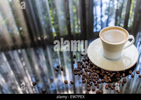 Coffee Cup Mug Little, Dark Roasted Spilled Beans On Table Stock Photo
