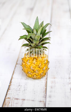 Close-up of a pineapple on a wooden table