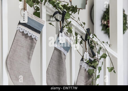 Christmas stockings with homemade nametags Stock Photo