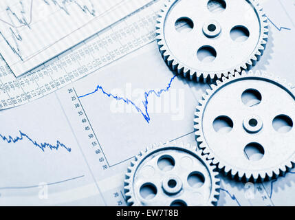 Graphics with curves, three gear wheels and a calculator Stock Photo