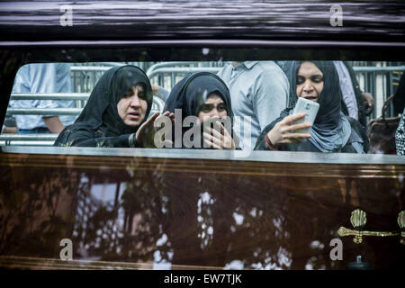 London, UK. 19th June, 2015. Muslim women mourn by a coffin carrying Hearse after a funeral service at the London Central Mosque on 2nd day of Ramadan.