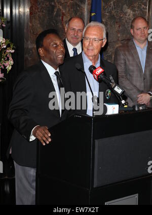 New York Cosmos legends, Pelé and Franz Beckenbauer, light up the Empire State Building in 'Cosmos Green' to celebrate the start of the soccer team's 2015 spring season  Featuring: Pelé, Franz Beckenbauer Where: New York City, New York, United States When: 17 Apr 2015 Stock Photo