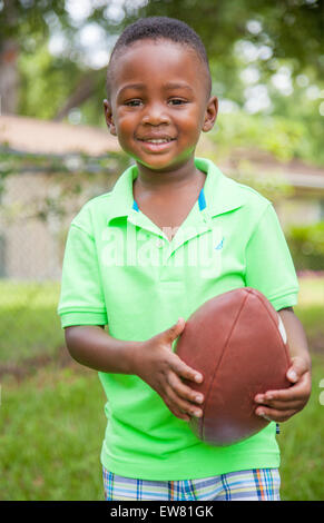Young African American boy age 4 playing in park in Florida Stock Photo