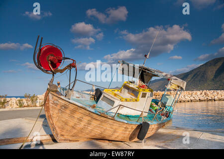 Wooden Fishing Boat out of sea in afternoon light in  Pomos harbor, Cyprus Stock Photo