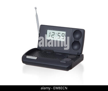 Old digital radio alarm clock isolated on white - Time is 12:59 Stock Photo