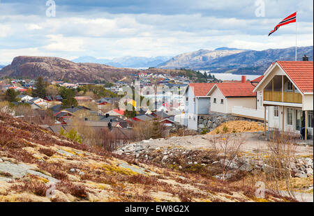 Rorvik. Fishing Norwegian town with colorful wooden houses on rocky hills Stock Photo