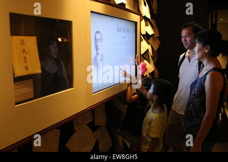 Singapore. 20th June, 2015. People visit a special exhibition themed Dr. Sun Yat Sen and His Family at the Sun Yat Sen Nanyang Memorial Hall (SYSNMH) in Singapore, June, 20, 2015. Opened on Saturday, the exhibition placed a special focus on Sun's loved ones, their personal sacrifices and contributions made in support of his cause with 173 objects ranging from photographs and documents, to personal belongings of Sun and his family members. Many of the objects are being presented in Singapore for the first time. © Bao Xuelin/Xinhua/Alamy Live News Stock Photo