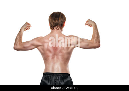 Man shows the muscles of the back. Isolated on white background. The concept of a strong man and a healthy lifestyle. Stock Photo