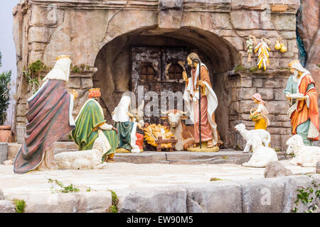 Nativity scene: a crib in Italy with Saint Joseph, The Blessed Virgin Mary and Infant Jesus, the Holy Family visited by sheperds and Magi Stock Photo