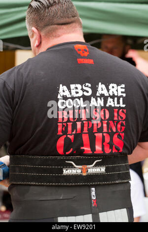 St Johns Square, Blackpool, Lancashire. 20th June, 2015. Strongmen go head to head in an exciting series of strong man events to determine who will be crowned as Blackpool’s Strongest Man 2015.  Events such as the 'Yoke Carry', 'Conan’s Wheel' and the 'Truck Pull' amongst others, test these immensely strong men to their physical limits.  Poor weather conditions didn't deter crowds from flocking to watch this exhibition of strength as part of Blackpool's Armed Forces week. Credit:  Cernan Elias/Alamy Live News Stock Photo