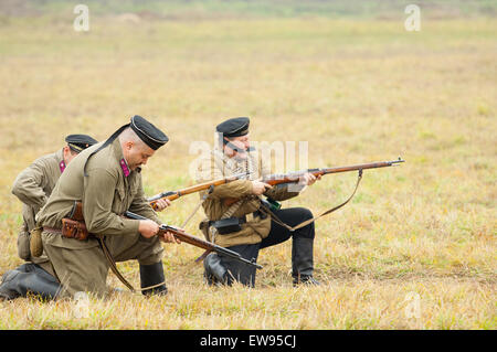 RUSSIA, BORODINO - OCTOBER 12: Unidentified armed seamem shooting on reenactment of the battle in WWII near the Borodino village in 1941, in Moscow region, Borodino, on 12 October, 2014, Russia Stock Photo