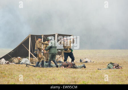 RUSSIA, BORODINO - OCTOBER 12: Unidentified armed soldiers get a captive on reenactment of the battle in WWII near the Borodino village in 1941, in Moscow region, Borodino, on 12 October, 2014, Russia Stock Photo