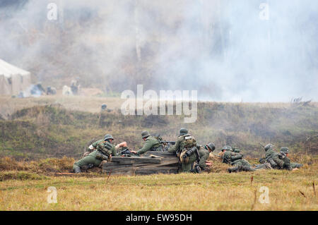 RUSSIA, BORODINO - OCTOBER 12: Unidentified armed german soldiers in battle on reenactment of the battle in WWII near the Borodino village in 1941, in Moscow region, Borodino, on 12 October, 2014, Russia Stock Photo