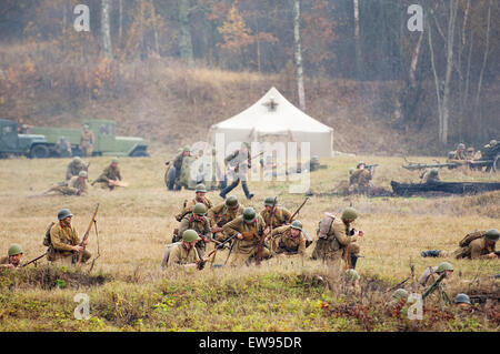 RUSSIA, BORODINO - OCTOBER 12: Unidentified armed russian soldiers defence on reenactment of the battle in WWII near the Borodino village in 1941, in Moscow region, Borodino, on 12 October, 2014, Russia Stock Photo