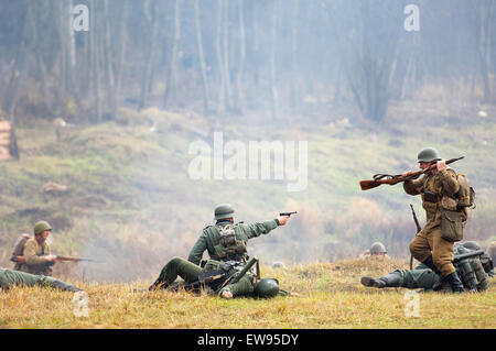 RUSSIA, BORODINO - OCTOBER 12: Unidentified armed soldiers fights and shooting on reenactment of the battle in WWII near the Borodino village in 1941, in Moscow region, Borodino, on 12 October, 2014, Russia Stock Photo