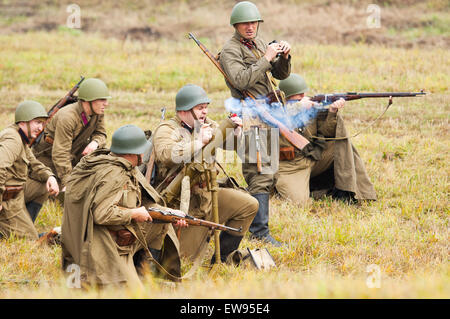 RUSSIA, BORODINO - OCTOBER 12: Unidentified soviet soldiers shooting by grenade launcher on reenactment of the battle in WWII near the Borodino village in 1941, in Moscow region, Borodino, on 12 October, 2014, Russia Stock Photo