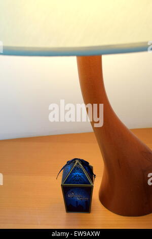 Table Lamp beside the book with Pencil and Dates Stock Photo